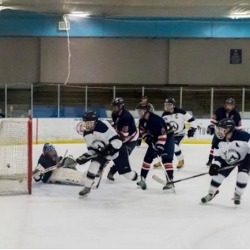 The AAHS hockey team in action.